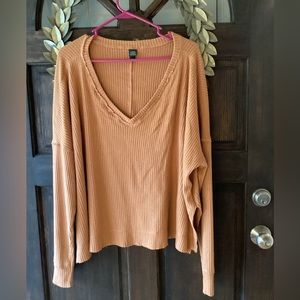 Super soft and comfy deep v neck sweater with vertical stripes. Usually layered